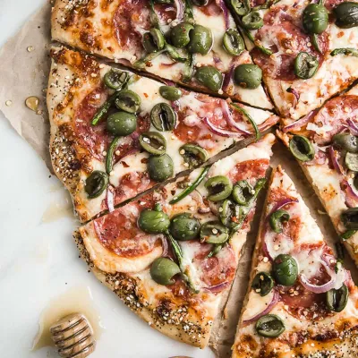 Fresh made-to-order pizza at Nose Creek Pizza Coventry Hills